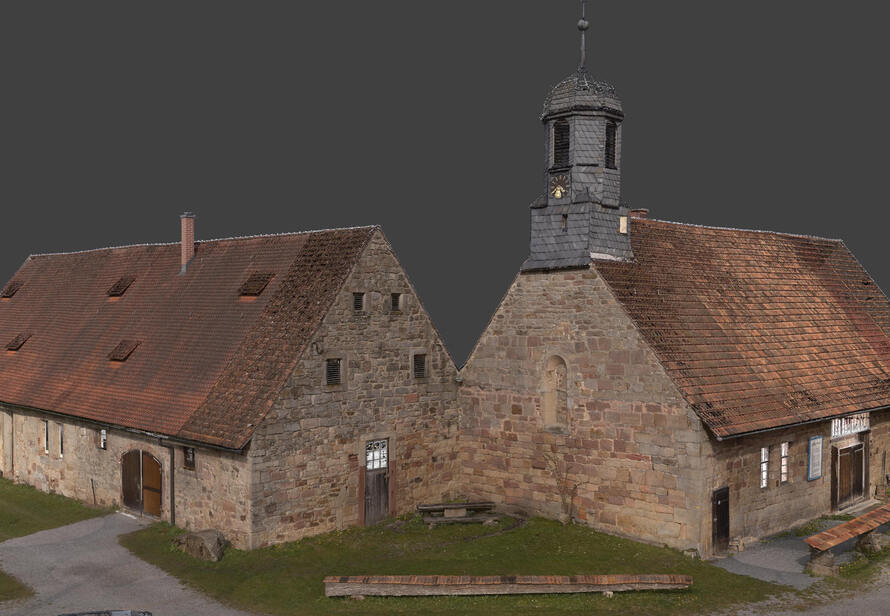Hochauflösende 3D-Punktwolke des denkmalgeschützten Klosters Trostadt in Thüringen mit detaillierter Darstellung von Natursteinfassade, Dachflächen und historischen Bauteilen.