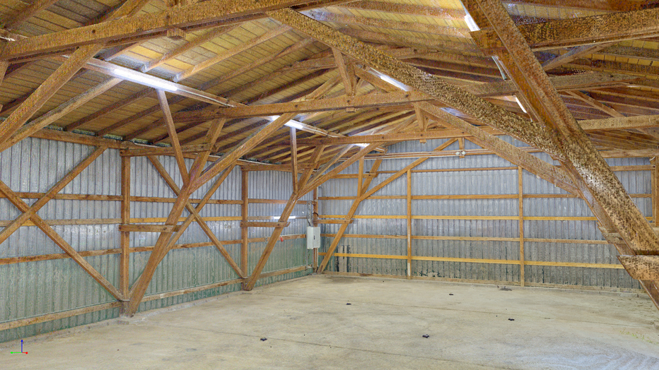 Zu sehen ist eine Punktwolke einer Halle von innen mit alles Holzbauteilen